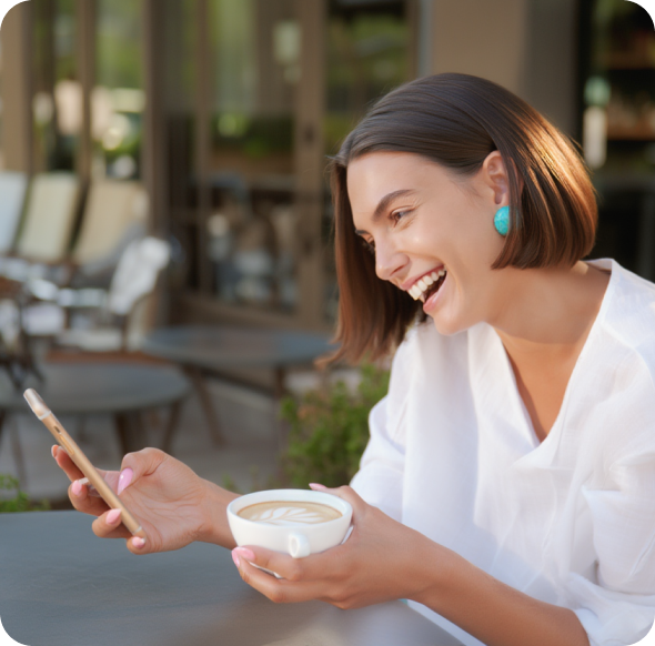 A creator smiling at her phone while subscriber payment activity appears in the foreground.